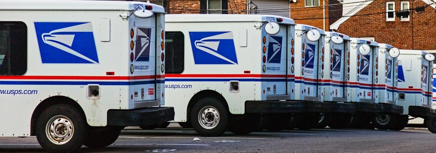 Person working on laptop with documents